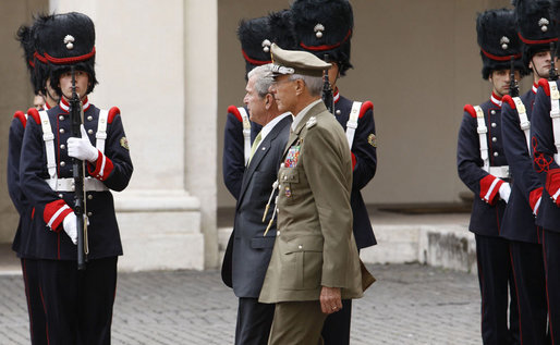 President George W. Bush, escorted by Italian General Rolando Mosca Moschini, passes the Guardia D'Onore Thursday, June 12, 2008, on his departure from Quirinale Palace in Rome. White House photo by Eric Draper