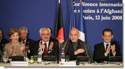 Mrs. Laura Bush joins in the applause during the International Conference in Support of Afghanistan Thursday, June 12, 2008 in Paris, where Mrs. Bush addressed the conference urging continued support for the Afghanistan people to build civic and economic institutions that can withstand the forces of oppression. Mrs. Bush is joined on the panel, from left, Afghanistan Foreign Minister Dr. Rangin Dadfar Spanta, Afghanistan President Hamid Karzai and French President Nicholas Sarkozy. White House photo by Shealah Craighead