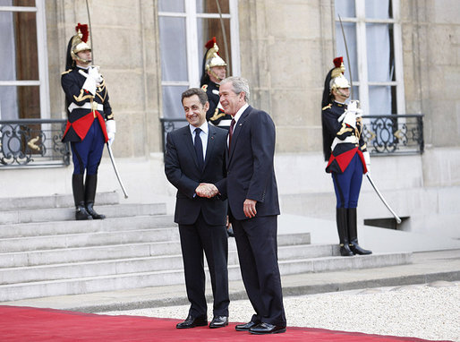 President George W. Bush is welcomed by French President Nicolas Sarkozy for a dinner Friday evening, June 13, 2008, at the Elysee Palace in Paris. White House photo by Eric Draper