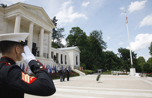 President George W. Bush is joined by two U.S. World War II Veterans during wreath-laying ceremonies Saturday, June 14, 2008, at the Suresnes American Cemetery and Memorial in Suresnes, France. White House photo by Eric Draper