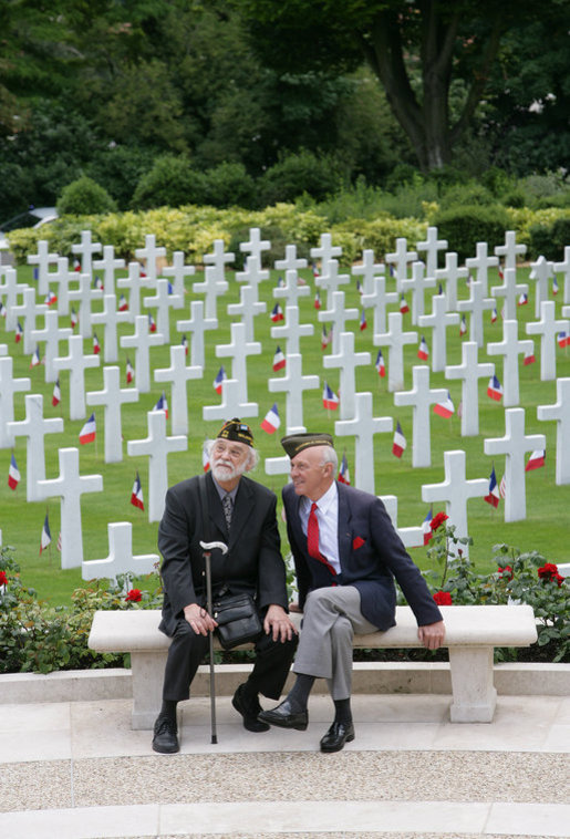 Military veterans sit on a bench at the Suresnes American Cemetery and Memorial in Paris on Saturday, June 14, 2008, awaiting the arrival of President George W. Bush. White House photo by Chris Greenberg