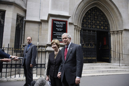 President George W. Bush and Laura Bush talk with reporters after attending Sunday morning church service at the American Cathedral of the Holy Trinity in Paris June 15, 2008. White House photo by Eric Draper