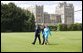 President George W. Bush and Laura Bush wave upon their arrival to Windsor Castle Sunday, June 15, 2008 in Windsor, England, escorted by Air Vice Marshal David Walker, where President Bush and Mrs. Bush met with Queen Elizabeth II and the Duke of Edinburgh Prince Phillip. White House photo by Eric Draper