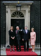 President George W. Bush waves to members of the media as he and Laura Bush are met by British Prime Minster Gordon Brown and his wife, Sarah, on their arrival Sunday, June 15, 2008 to 10 Downing Street in London. White House photo by Chris Greenberg