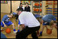 Mrs. Laura Bush watches a basketball demonstration at the Lough View Integrated Primary School’s Gym in Belfast, Northern Ireland, June 16, 2008, during her visit to the school with President Bush. White House photo by Shealah Craighead