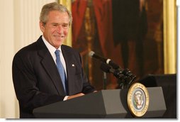 President George W. Bush welcomes guests and entertainers Tuesday, June 17, 2008 to the East Room of the White House, in honor of Black Music Month.  White House photo by Luke Sharrett