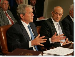 President George W. Bush talks to reporters about the government's response to the Midwest floods Tuesday morning, June 17, 2008. in the Roosevelt Room of the White House. Homeland Security Secretary Michael Chertoff, right, was one of the key leaders briefing the President. President Bush said he will travel to Iowa on Thursday to view the damage himself. White House photo by Joyce N. Boghosian