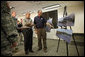 President George W. Bush is briefed on the Midwest flooding by Dick Hainje, Regional Administrator for the Federal Emergency Management Agency, during a visit Thursday, June 19, 2008, to Cedar Rapids, Iowa. The President spent the day touring the devastation left in the wake of the flooding Cedar and Iowa rivers. White House photo by Eric Draper