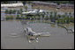 Marine One with President George W. Bush aboard flies over a flooded University of Iowa softball complex in Iowa City Thursday, June 19, 2008, during his aerial tour of the region. White House photo by Eric Draper