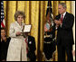 President George W. Bush leads the applause for Mrs.Tom Lantos after she received the 2008 Presidential Medal of Freedom citation in honor of her late husband, California Congressman Tom Lantos, during ceremonies Thursday, June 19, 2008, in the East Room of the White House. White House photo by David Bohrer