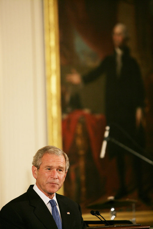 President George W. Bush welcomes guests Thursday evening, June 19, 2008 to the East Room of the White House, during a social dinner in honor of American jazz. White House photo by Chris Greenberg