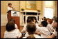 During remarks, Mrs. Bush calls on a student to name a type of plant they planted earlier in the day during National Park First Bloom event at the Charlestown Navy Yard in Boston, MA, Sunday, June 22, 2008. White House photo by Shealah Craighead