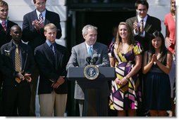 President George W. Bush is applauded as he addresses his remarks to athletes, their family members and invited guests Tuesday, June 24, 2008 at the White House, in honor of the 2007 and 2008 NCAA Sports Champions. White House photo by Luke Sharrett