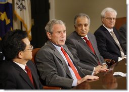 President George W. Bush speaks to reporters at the National Security Advisor's meeting with representatives of the United Nations Security Council Wednesday, June 25, 2008 at the White House. From left are, Ambassador Liu Zhenmin of China, U.S. Ambassador Zalmay Khalilzad and Ambassador Vitally Ivanovich Churkin of Russia. White House photo by Eric Draper