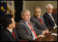 President George W. Bush speaks to reporters at the National Security Advisor's meeting with representatives of the United Nations Security Council Wednesday, June 25, 2008 at the White House. From left are, Ambassador Liu Zhenmin of China, U.S. Ambassador Zalmay Khalilzad and Ambassador Vitally Ivanovich Churkin of Russia. White House photo by Eric Draper