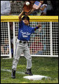 The first baseman of the Jose M. Rodriguez Little League Angels from Manati, Puerto Rico reaches up to catch the ball during the season opener of the 2008 Tee Ball on the South Lawn Monday, June 30, 2008, on the South Lawn of the White House. White House photo by Eric Draper