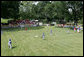 A view from the outfield on the South Lawn of the white House shows the opening game of the the 2008 Tee Ball season in action Monday, June 30, 2008, between the Cramer Hill Little league Red Sox of Camden, N.J., and the Jose M. Rodriguez Little League Angels of Manati, Puerto Rico. White House photo by Joyce N. Boghosian