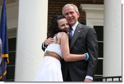 President George W. Bush congratulates new United States Citizens at Monticello's 46th Annual Independence Day Celebration and Naturalization Ceremony Friday, July 4. 2008, in Charlottesville, VA.  White House photo by Joyce N. Boghosian