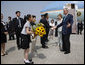 President George W. Bush and Laura Bush are welcomed on their arrival Sunday, July 6, 2008 to the New Chitose International Airport, to attend the Group of Eight Summit in Toyako, Japan. White House photo by Eric Draper