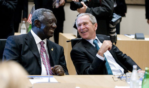 President George W. Bush shares a moment with President John Agyekum Kufuor of Ghana prior to the start Monday, July 7, 2008, of the G8 Working Session with Africa Outreach Representatives in Toyako, Japan. White House photo by Eric Draper