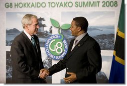 President George W. Bush and President Jakaya Kikwete exchange handshakes Monday, July 7, 2008, after meeting the media in Toyako, Japan, following the G-8 Working Session with the Africa Outreach Representatives. White House photo by Eric Draper