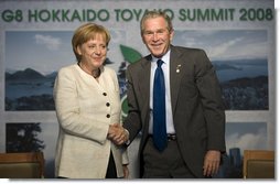 President George W. Bush and Germany’s Chancellor Angela Merkel shake hands after meeting Tuesday, July 8, 2008, at the G-8 Summit in Toyako, Japan.  White House photo by Eric Draper