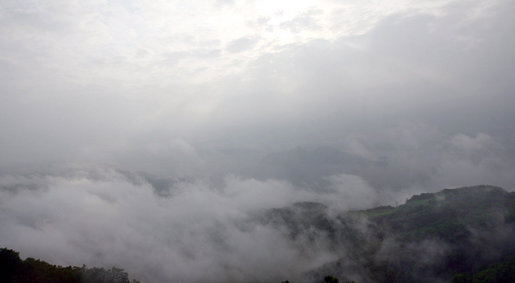 Lake Toya is barely visible through the early morning fog Tuesday, July 8, 2008. The volcanic caldera lake in Shikotsu-Toya National Park on Hokkaido, Japan is part of the scenic setting for the 2008 G-8 Summit. White House photo by Shealah Craighead