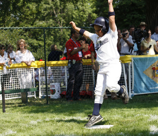 Six-year-old Tucker Tekautz of the Central U.S. All-Stars crosses home plate Wednesday, July 16, 2008, during their Tee Ball at the White House matchup against the Eastern U.S. All-Stars. White House photo by Eric Draper