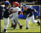 Reggie Graff, right, age 6, from St. George, Utah, tags North Carolina's Avery Shane, age 5, center, as Hawaii's Joshua Miyazawa, age 5, watches during All-Star tee ball action on July 16, 2008 on the South Lawn of the White House. Shane, from Rutherfordton, N.C., was on the Southern team and Graff and Miyazawa, from Honolulu were on the Western team. Two other teams, representing the Central and Eastern sections of the country, played and one child represented each state. President George W. Bush and Mrs. Laura Bush watched the action from a bleachers set up on the grounds for the kids' families. White House photo by Eric Draper