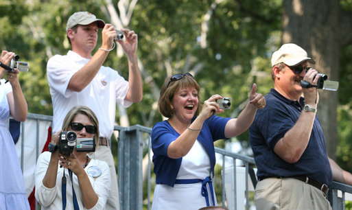 Families root for their kids as they also document the All-Star tee-ball action at the White House, July 16, 2008 – a hot Wednesday afternoon in Washington, D.C. One child represented each state and the District of Columbia in the action on the South Lawn, which was attended by both President George W. Bush and Mrs. Laura Bush. White House photo by Shealah Craighead