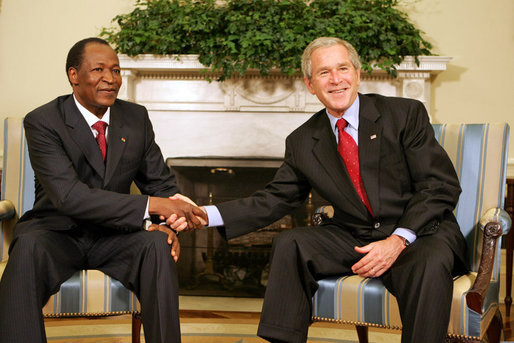 President George W. Bush shakes hands with Burkina Faso President Blaise Compaore, during a meeting Wednesday, July 16, 2008, in the Oval Office of the White House. White House photo by Joyce N. Boghosian