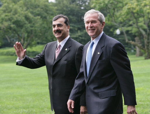 President George W. Bush walks with Pakistani Prime Minister Syed Yousaf Raza Gillani from the Oval Office to deliver their remarks Monday, July 28, 2008, on the South Lawn of the White House. White House photo by Chris Greenberg