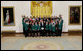 President George W. Bush poses with members of the Texas 4-H and Youth Development Program in the East Room of the White House, Monday, July 28, 2008. White House photo by Chris Greenberg