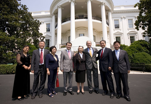 President George W. Bush poses for a photo at the South Portico entrance to the White House Tuesday, July 29, 2008, with Chinese Human Rights Activists, from left, Ciping Huang, Wei Jingsheng, Sasha Gong, Alim Seytoff, interpreter; Rebiya Kadeer, Harry Wu and Bob Fu, following their meeting at the White House. White House photo by Eric Draper