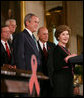 President George W. Bush is introduced to the podium by Mrs. Laura Bush Wednesday, July 30, 2008 in the East Room of the White House, prior to signing H.R. 5501, the Tom Lantos and Henry J. Hyde United States Global Leadership Against HIV/AIDS, Tuberculosis and Malaria Reauthorization Act of 2008. White House photo by Joyce N. Boghosian