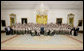 President George W. Bush poses for a photo Thursday, July 31, 2008 in the East Room of the White House, with members of the Boy Scouts and the families of Boy Scout victims of the tornado that struck the Little Sioux Scout Ranch in Little Sioux, Iowa on June 11, 2008. White House photo by Chris Greenberg