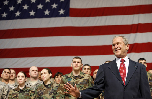 President George W. Bush waves to the crowd after arriving on stage Monday, Aug. 4, 2008, at Eielson Air Force Base, Alaska, where he addressed military personnel before continuing on to South Korea. White House photo by Eric Draper