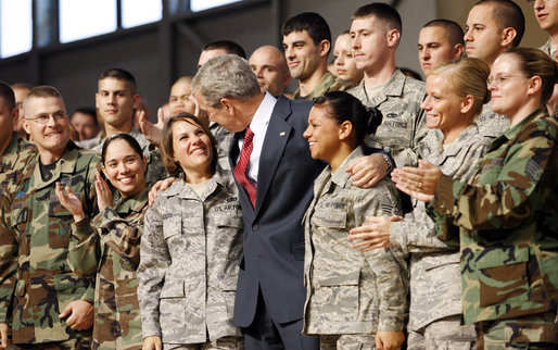 President George W. Bush stands with military personnel on stage Monday, Aug. 4, 2008, after delivering remarks at Eielson Air Force Base during a stop in Alaska en route to South Korea. White House photo by Eric Draper