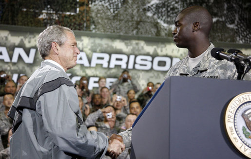 President George W. Bush shakes hands with U.S. Army Cpl. Victor Berlus before delivering his remarks to the U.S. Army Garrison-Yongsan Wednesday, August 6, 2008, in Seoul, South Korea. White House photo by Eric Draper