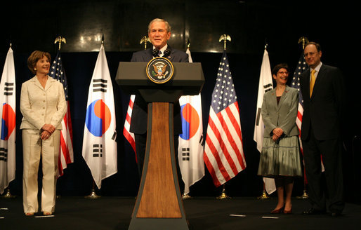 President George W. Bush and Mrs. Laura Bush receive a warm welcome during their visit Wednesday, Aug. 6, 2008, at the U.S. Embassy in Seoul. With them on stage are U.S. Ambassador to Korea Alexander "Sandy" Vershbow and Mrs. Lisa Vershbow. White House photo by Shealah Craighead