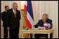 President George W. Bush is joined by Prime Minister Samak Sundaravej of Thailand as he signs a guest book Wednesday, Aug. 6, 2008, on his arrival to the Government House in Bangkok. White House photo by Chris Greenberg