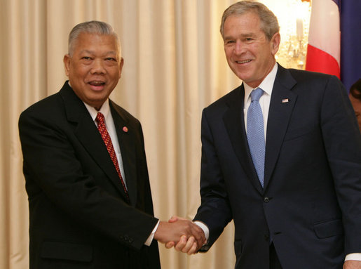 President George W. Bush is greeted by Prime Minister Samak Sundaravej of Thailand at a welcoming ceremony Wednesday, Aug. 6, 2008, in the Ivory Room of the Government House in Bangkok. White House photo by Chris Greenberg