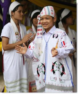 Residents of the Mae La Refugee Camp at Mae Sot, Thailand, perform traditional dance for Mrs. Laura Bush during her visit to the camp on the Burma border on Aug. 7, 2008. It has been almost 20 years since the August 8, 1988 crackdown in Burma which began forcing residents from the country. Many of the people in the Mae La Refugee Camp and the other eight camps along the border have been born in the camps or lived most of their lives in the camps, waiting for conditions to improve in Burma or to move to the United States and other countries. White House photo by Shealah Craighead