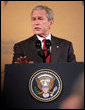 President George W. Bush gestures as he delivers remarks at the Queen Sirikit National Convention Center Thursday, August 7, 2008, in the Bangkok. White House photo by Chris Greenberg