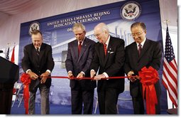 President George W. Bush and former President George H.W. Bush join U.S. Ambassador to China Sandy Randt and Dai Bingguo, People’s Republic of China State Councilor, as they participate in a ribbon-cutting ceremony Friday, Aug. 8, 2008, at the U.S. Embassy in Beijing. White House photo by Eric Draper