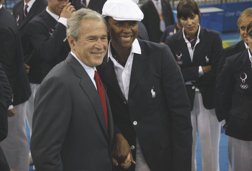 President George W. Bush stands with Danielle Scott-Arruda, a member of the U.S. Olympic Volleyball team, as he meets with the athletes Friday, Aug. 8, 2008, prior to the start of the Opening Ceremony of the 2008 Summer Olympic Games in Beijing. White House photo by Eric Draper