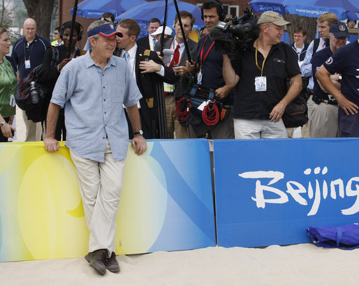 President George W. Bush is the center of attention as he watches U.S. beach volleyball practice Saturday, Aug. 9, 2008, at Chaoyang Park in Beijing. White House photo by Eric Draper