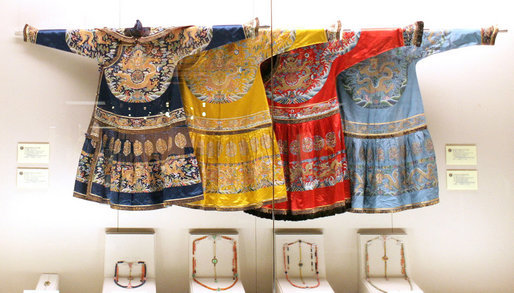 A display of three dresses and some jewelry is seen at the Exhibition of Imperial Garments and Jewelry viewed by Mrs. Laura Bush during her tour Saturday, Aug. 9, 2008, of the Forbidden City in Beijing. White House photo by Shealah Craighead