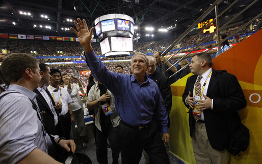 President George W. Bush waves to fans as he arrives Sunday, Aug. 10, 2008 to attend the Group B men's Olympic basketball game between the U.S. and China, at the 2008 Summer Olympic Games in Beijing. White House photo by Eric Draper