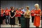 Mrs. Laura Bush and Mrs. Cindy McCain applaud the efforts of volunteers who are setting up a space in Minneapolis Convention Center Monday, September 1, 2008, to assemble and ship out care kits to support the victims of Hurricane Gustav. White House photo by Shealah Craighead